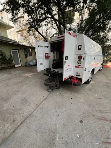Magnet Plumbing service vehicle on-site for Grease Trap Cleaning in Golden Beach